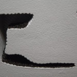 Marks and Dents Were Always Part of This Picture (detail) / ceramic, anthracite, drywall, burnt wood 63 x 42 1/2 x 5 IN
